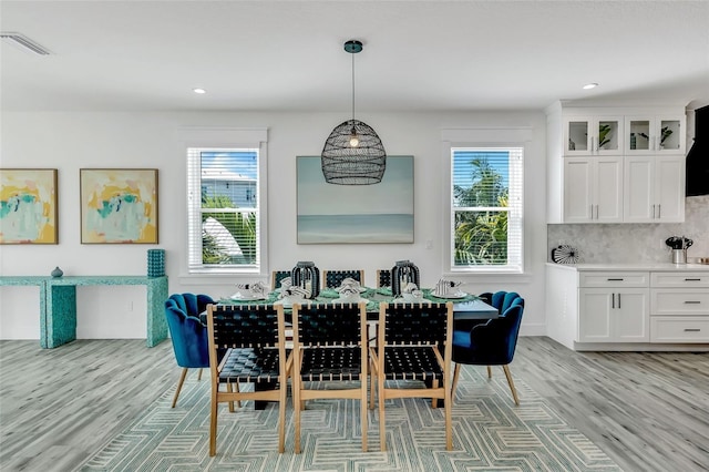5219 Calle Menorca, Sarasota, FL 34242 - dining area with light wood finished floors, healthy amount of natural light, and recessed lighting