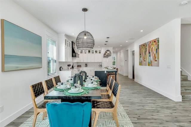 5219 Calle Menorca, Sarasota, FL 34242 - dining room featuring light wood-style flooring, baseboards, and recessed lighting