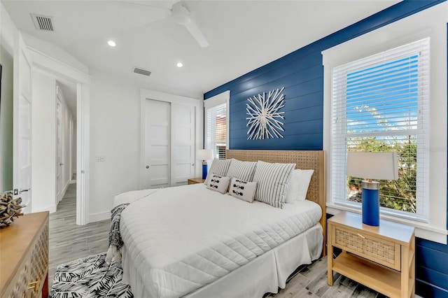 5219 Calle Menorca, Sarasota, FL 34242 - bedroom with light wood-style floors, recessed lighting, a closet, and ceiling fan