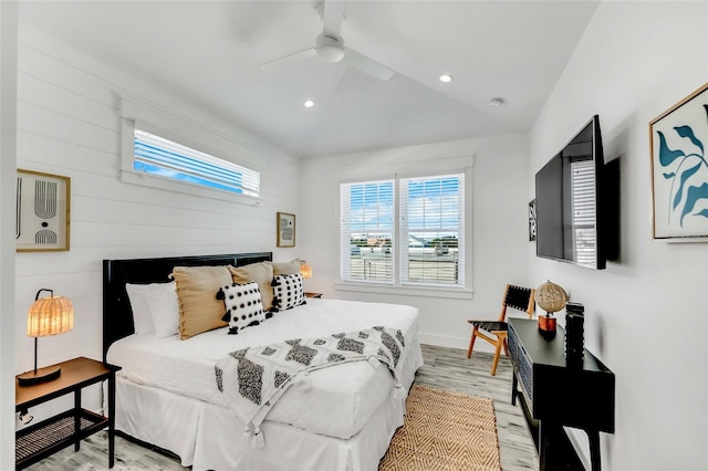 5219 Calle Menorca, Sarasota, FL 34242 - bedroom with light wood-type flooring, recessed lighting, baseboards, ceiling fan, and wooden walls