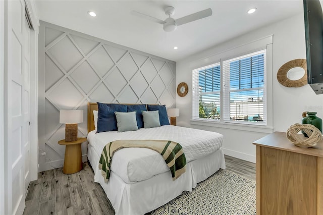5219 Calle Menorca, Sarasota, FL 34242 - bedroom featuring wood finished floors, baseboards, recessed lighting, and a ceiling fan