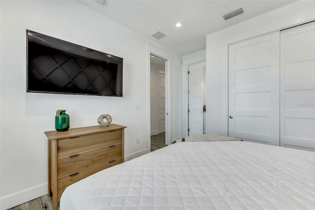 5219 Calle Menorca, Sarasota, FL 34242 - bedroom with baseboards, wood finished floors, recessed lighting, and a closet