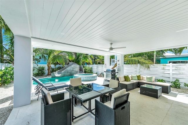 5219 Calle Menorca, Sarasota, FL 34242 - fenced backyard with a patio, an outdoor hangout area, outdoor dining space, ceiling fan, and a pool with connected hot tub