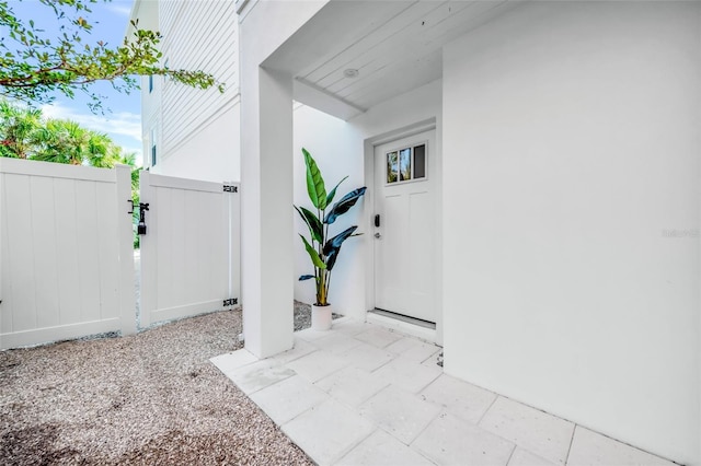 5219 Calle Menorca, Sarasota, FL 34242 - view of exterior entry with stucco siding and a gate