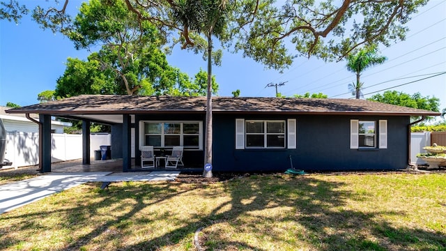 4310 7th Ave W, Bradenton, FL 34209 - ranch-style home featuring concrete driveway, an attached carport, and stucco siding