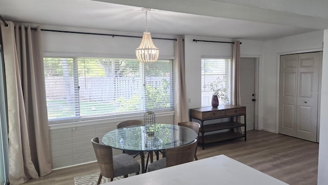 3730 Ferguson St, Sarasota, FL 34233 - dining room with a chandelier and wood finished floors
