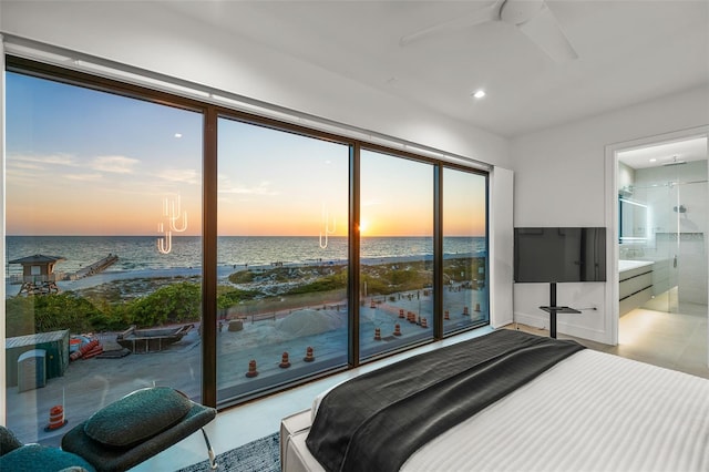 100 6th St S, Bradenton Beach, FL 34217 - bedroom featuring a water view, recessed lighting, ensuite bath, and a chandelier