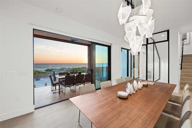 100 6th St S, Bradenton Beach, FL 34217 - dining area featuring stairway and a water view