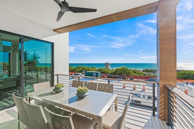 100 6th St S, Bradenton Beach, FL 34217 - balcony featuring a ceiling fan, a water view, and outdoor dining area