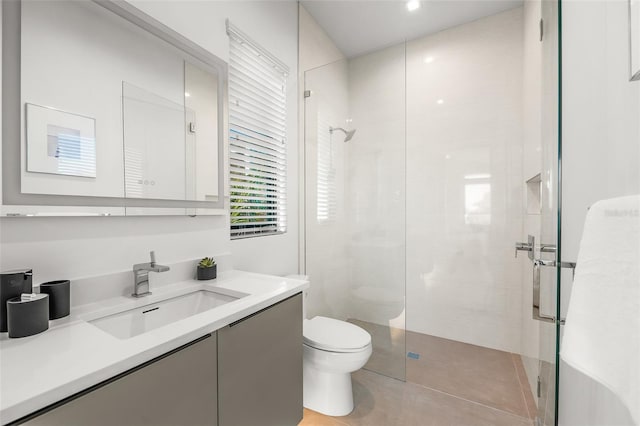 100 6th St S, Bradenton Beach, FL 34217 - full bathroom featuring toilet, vanity, a shower stall, and tile patterned flooring