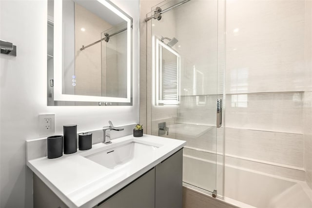 100 6th St S, Bradenton Beach, FL 34217 - bathroom with vanity and combined bath / shower with glass door