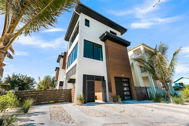 100 6th St S, Bradenton Beach, FL 34217 - contemporary home with stucco siding and a garage