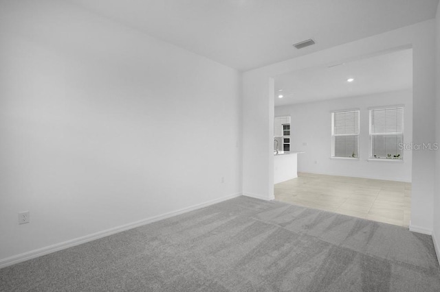 8632 Snowfall St, Sarasota, FL 34241 - carpeted spare room with baseboards and recessed lighting