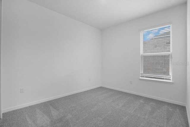 8632 Snowfall St, Sarasota, FL 34241 - carpeted spare room with baseboards