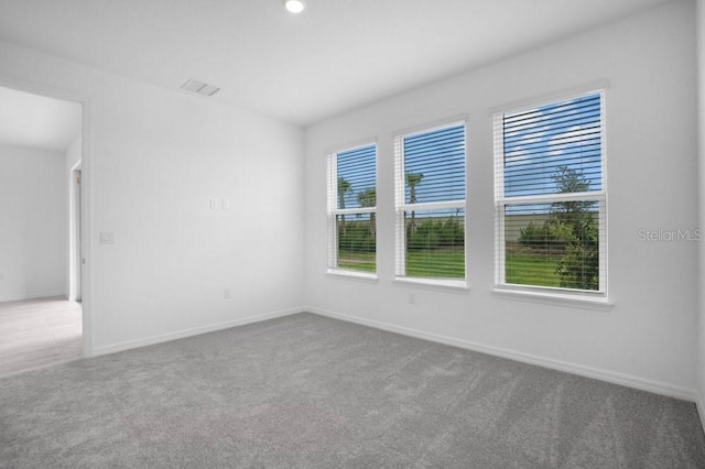 8632 Snowfall St, Sarasota, FL 34241 - carpeted empty room with baseboards