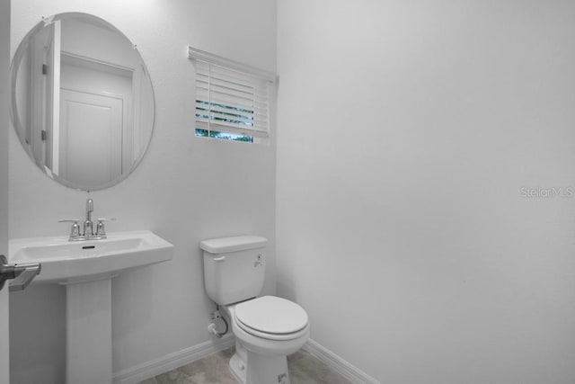 8632 Snowfall St, Sarasota, FL 34241 - half bathroom featuring toilet and baseboards