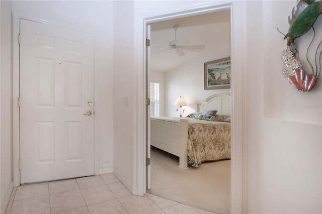 5330 Hyland Hills Ave Unit 2324, Sarasota, FL 34241 - foyer featuring ceiling fan, light tile patterned floors, vaulted ceiling, and baseboards