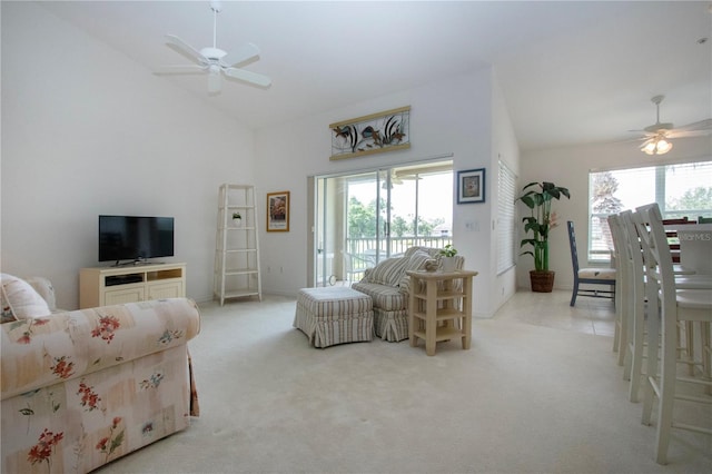 5330 Hyland Hills Ave Unit 2324, Sarasota, FL 34241 - living room featuring a ceiling fan, healthy amount of natural light, carpet flooring, and high vaulted ceiling