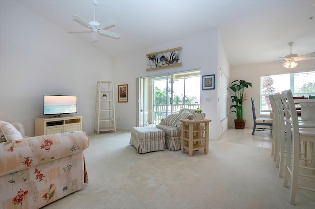 5330 Hyland Hills Ave Unit 2324, Sarasota, FL 34241 - living room with ceiling fan, healthy amount of natural light, carpet floors, and high vaulted ceiling