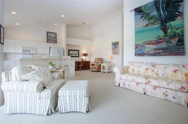5330 Hyland Hills Ave Unit 2324, Sarasota, FL 34241 - living area with light carpet, high vaulted ceiling, recessed lighting, and ceiling fan
