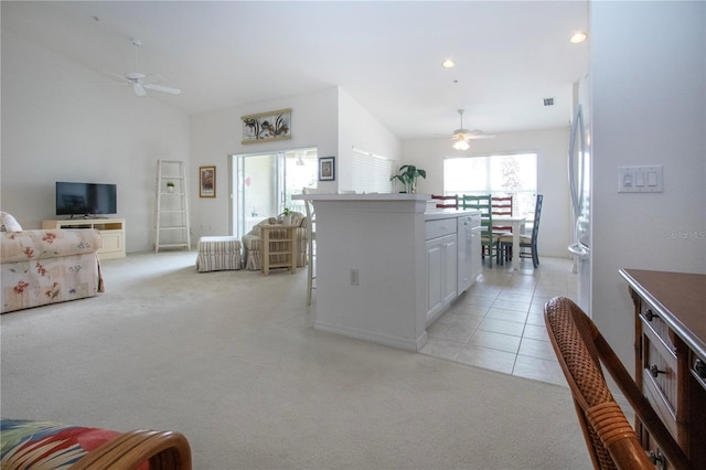 5330 Hyland Hills Ave Unit 2324, Sarasota, FL 34241 - kitchen with ceiling fan, light colored carpet, a center island, open floor plan, and lofted ceiling