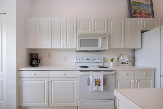 5330 Hyland Hills Ave Unit 2324, Sarasota, FL 34241 - kitchen with white appliances, white cabinetry, and light countertops