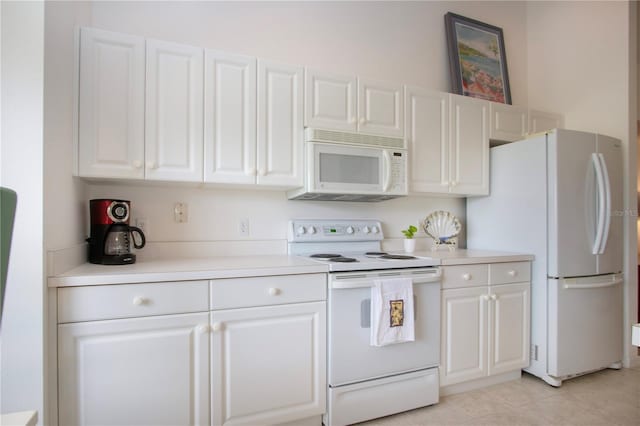 5330 Hyland Hills Ave Unit 2324, Sarasota, FL 34241 - kitchen with white appliances, white cabinetry, light countertops, and light tile patterned floors