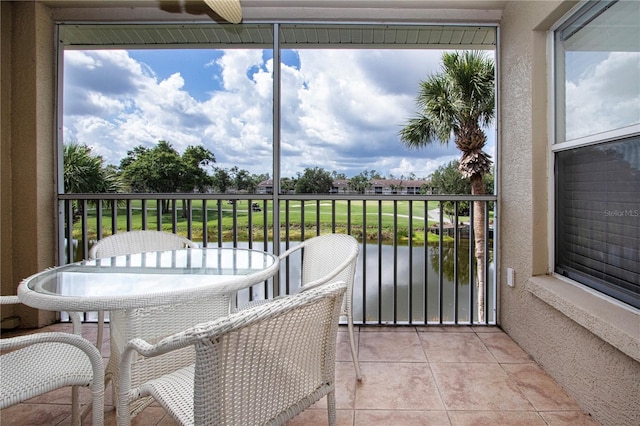 5330 Hyland Hills Ave Unit 2324, Sarasota, FL 34241 - sunroom / solarium featuring a water view