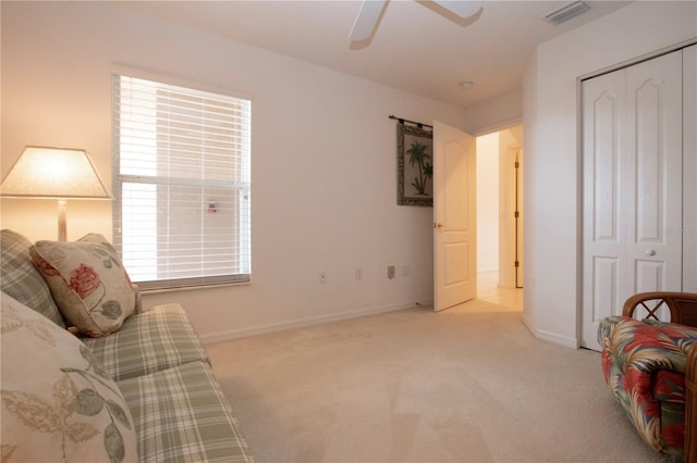 5330 Hyland Hills Ave Unit 2324, Sarasota, FL 34241 - living area featuring carpet, ceiling fan, and baseboards
