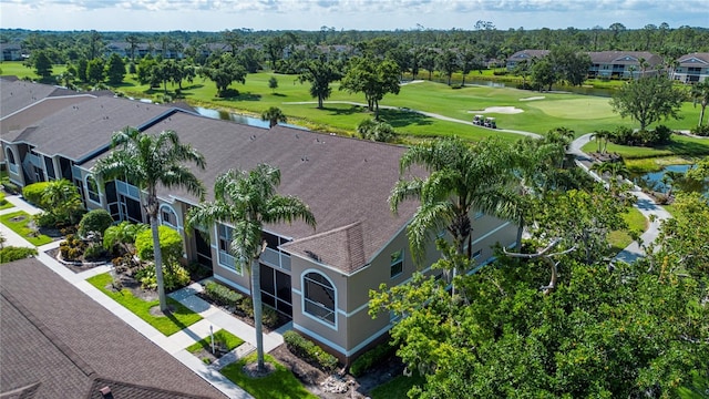 5330 Hyland Hills Ave Unit 2324, Sarasota, FL 34241 - aerial perspective of suburban area featuring a golf course, a nearby body of water, and a tree filled landscape