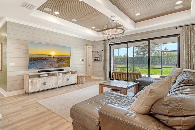1919 Woodleaf Hammock Ct, Bradenton, FL 34211 - living room featuring a chandelier, wood finished floors, wooden walls, a raised ceiling, and recessed lighting
