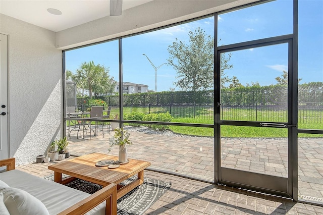 1919 Woodleaf Hammock Ct, Bradenton, FL 34211 - sunroom / solarium with outdoor dining space and healthy amount of natural light