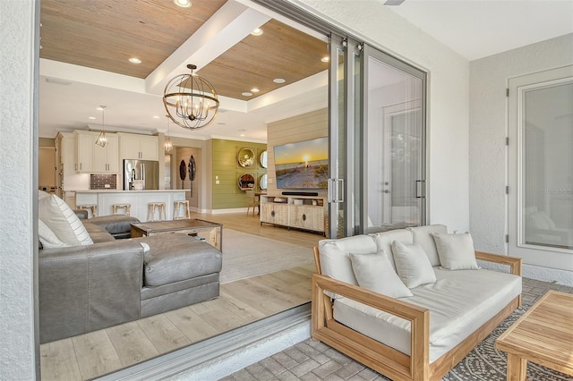 1919 Woodleaf Hammock Ct, Bradenton, FL 34211 - living area with recessed lighting, a chandelier, wood ceiling with exposed beams, a textured wall, and light wood-style floors