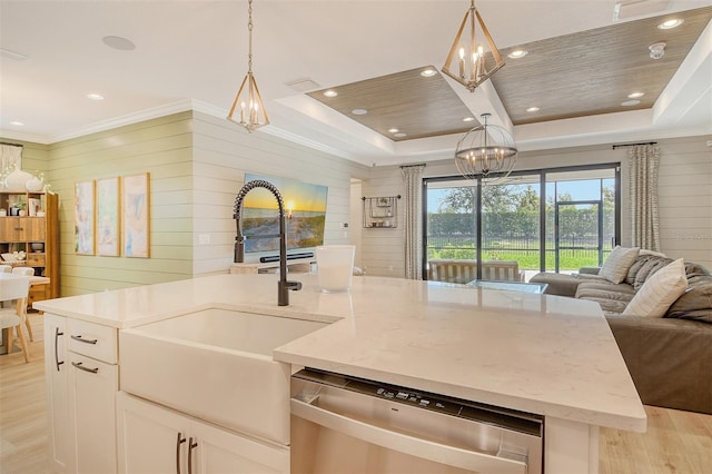 1919 Woodleaf Hammock Ct, Bradenton, FL 34211 - kitchen featuring open floor plan, stainless steel dishwasher, a chandelier, light wood finished floors, and a raised ceiling