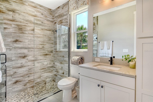 1919 Woodleaf Hammock Ct, Bradenton, FL 34211 - full bathroom featuring a stall shower, vanity, toilet, and tile patterned flooring