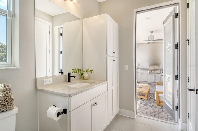 1919 Woodleaf Hammock Ct, Bradenton, FL 34211 - bathroom with vanity, toilet, and baseboards