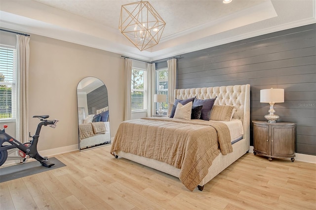 1919 Woodleaf Hammock Ct, Bradenton, FL 34211 - bedroom with a raised ceiling, light wood finished floors, a chandelier, baseboards, and recessed lighting