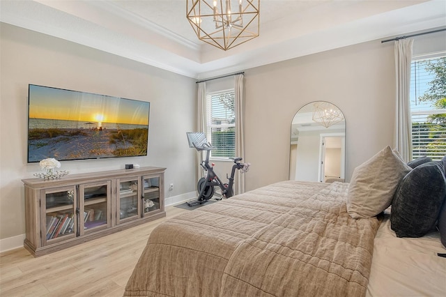 1919 Woodleaf Hammock Ct, Bradenton, FL 34211 - bedroom with a chandelier, wood finished floors, ornamental molding, a tray ceiling, and baseboards
