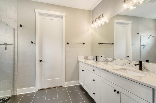 1919 Woodleaf Hammock Ct, Bradenton, FL 34211 - full bathroom with double vanity, tile patterned flooring, baseboards, and a tile shower