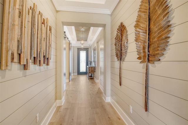1919 Woodleaf Hammock Ct, Bradenton, FL 34211 - corridor featuring ornamental molding, light wood-style flooring, wood walls, and baseboards