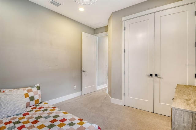 1919 Woodleaf Hammock Ct, Bradenton, FL 34211 - bedroom with light colored carpet, baseboards, a closet, and recessed lighting