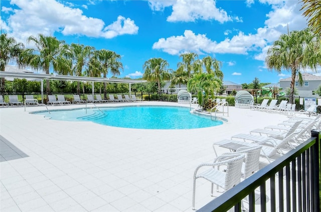 1919 Woodleaf Hammock Ct, Bradenton, FL 34211 - community pool featuring a patio