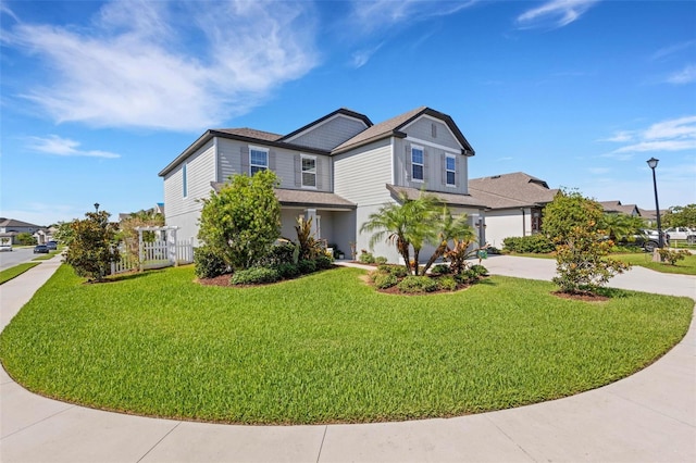 2332 Mizner Bay Ave, Bradenton, FL 34208 - view of front of home with driveway, a front lawn, and roof with shingles