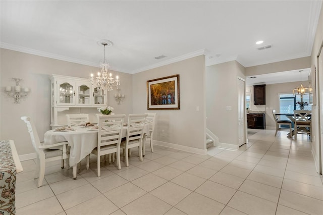 2332 Mizner Bay Ave, Bradenton, FL 34208 - dining space with a chandelier, light tile patterned floors, stairway, and crown molding