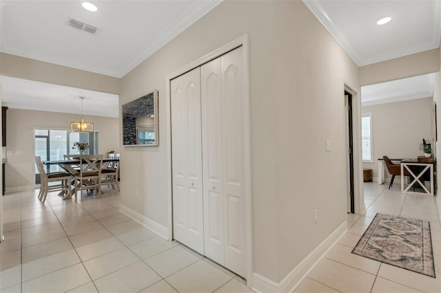 2332 Mizner Bay Ave, Bradenton, FL 34208 - hall with plenty of natural light, light tile patterned floors, ornamental molding, recessed lighting, and a chandelier