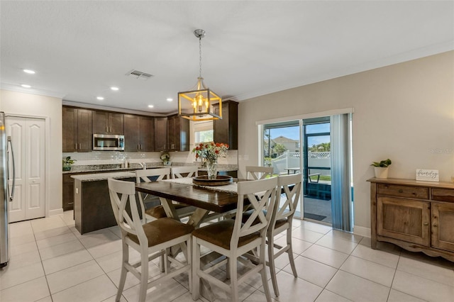 2332 Mizner Bay Ave, Bradenton, FL 34208 - dining room featuring light tile patterned floors, crown molding, a chandelier, and recessed lighting