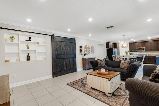 2332 Mizner Bay Ave, Bradenton, FL 34208 - living area featuring a barn door, recessed lighting, crown molding, and light tile patterned floors