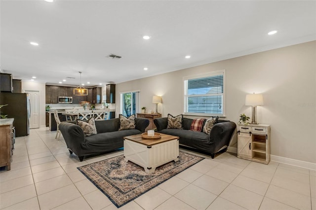 2332 Mizner Bay Ave, Bradenton, FL 34208 - living room featuring recessed lighting, crown molding, and light tile patterned floors