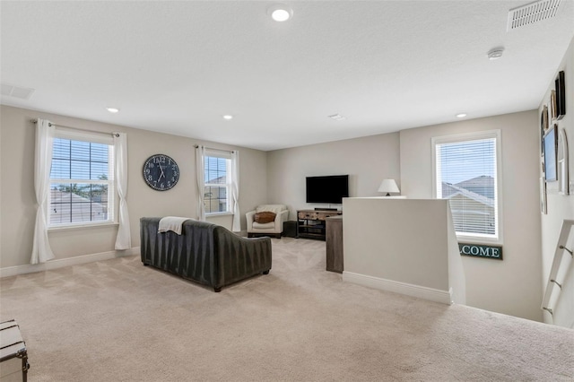 2332 Mizner Bay Ave, Bradenton, FL 34208 - living room featuring light colored carpet and recessed lighting