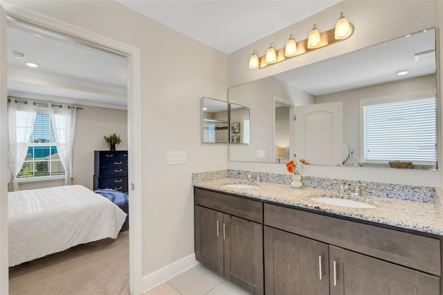 2332 Mizner Bay Ave, Bradenton, FL 34208 - ensuite bathroom featuring double vanity and baseboards